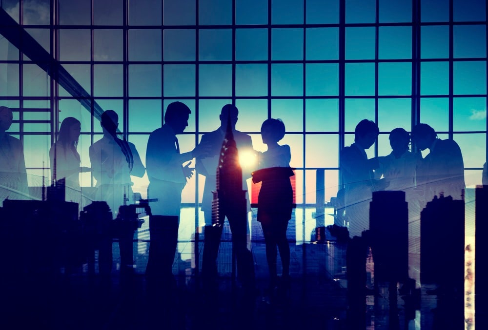 VNV Events-group-business-people-brainstorming-with-silhouette-sunset