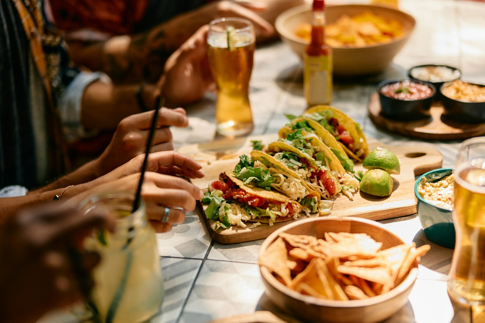 Close up of people eating in Mexican restaurant.