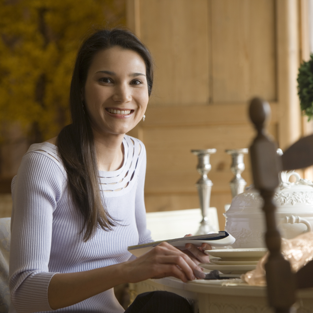 vnv events: Wedding decor ideas in Florida - "young smiling florist showing white floral decor to event manager with clipboard in event hall"-3