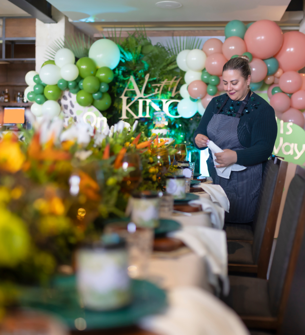 vnv events: Wedding decor ideas in Florida - "young smiling florist showing white floral decor to event manager with clipboard in event hall"-1