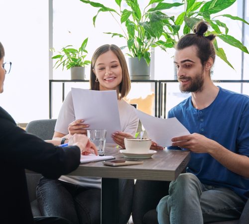 Wedding travel manager, realtor broker, bank insurance agent working with young couple